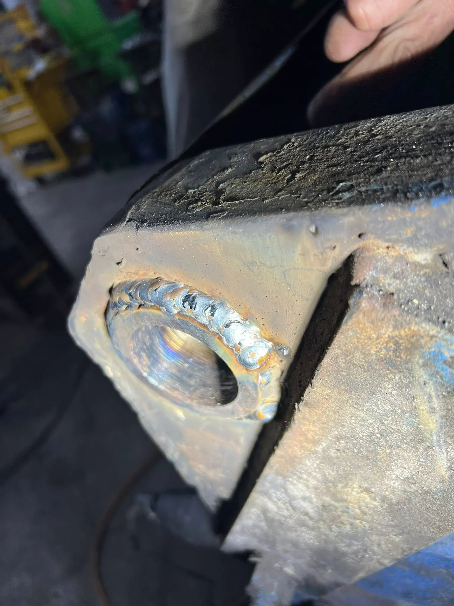 Fresh weld bead built up around a worn pivot bore